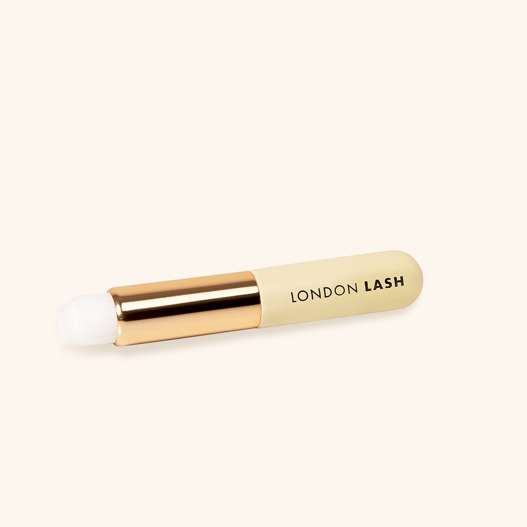 Lash Shampoo Brush from London Lash, travel-sized, perfect for on-the-go lash and brow cleansing.